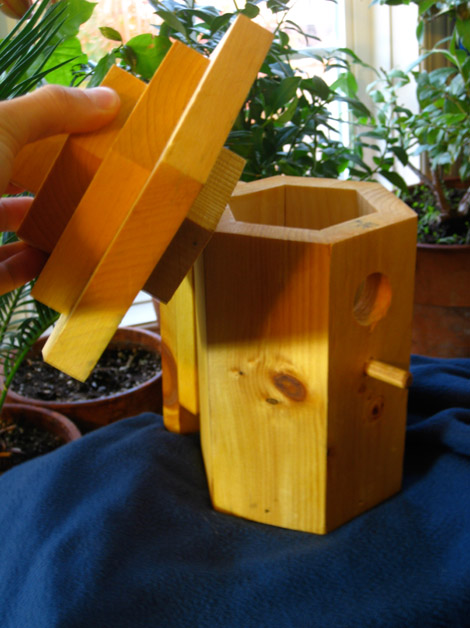 A birdhouse that opens from the top does not disturb the nest and is easy to clean