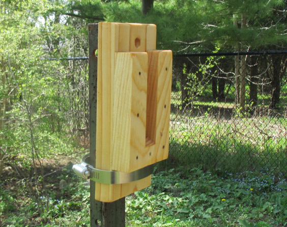 A wooden mounting bracket to make it easy to hang a birdhouse