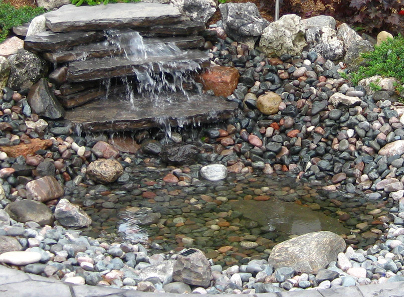 Pondless waterfall for attracting birds to your backyard